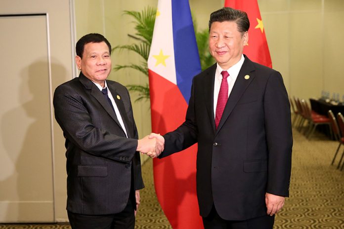 President Rodrigo Duterte and Chinese President Xi Jinping greet each during a bilateral meeting at the sidelines of the Asia-Pacific Economic Cooperation (APEC) Leaders' Summit in Lima, Peru on November 19. REY BANIQUET/ Presidential Photo