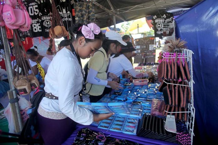 Delegates of Batang Pinoy 2016 National Championship shop for souvenir items at the makeshift stores inside the Davao del Norte Sports and Tourism Complex compound in Tagum City. LEAN DAVAL JR.