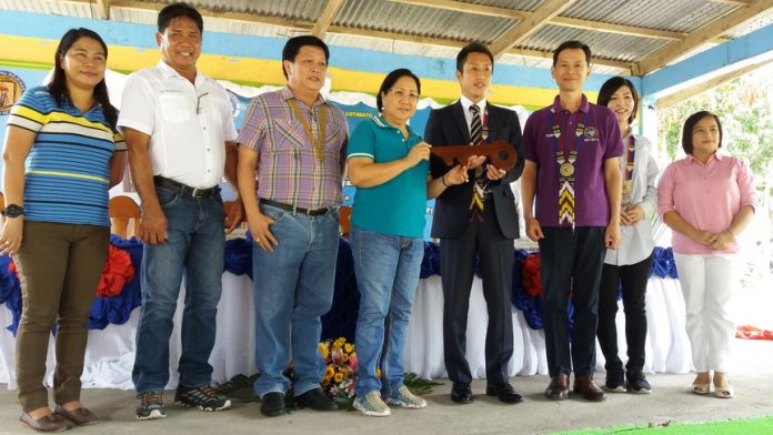 Hiroyuki Enoki (3rd from right), the First Secretary and Labour Attache of the Embassy of Japan and Gov. Daisy Avance-Fuentes (2nd from left) led the cutting of ribbon during the turn-over of the three units of two-classroom buildings in Dumadalig, Tantangan, South Cotabato last November 25, 2016. ALEXANDER LOPEZ