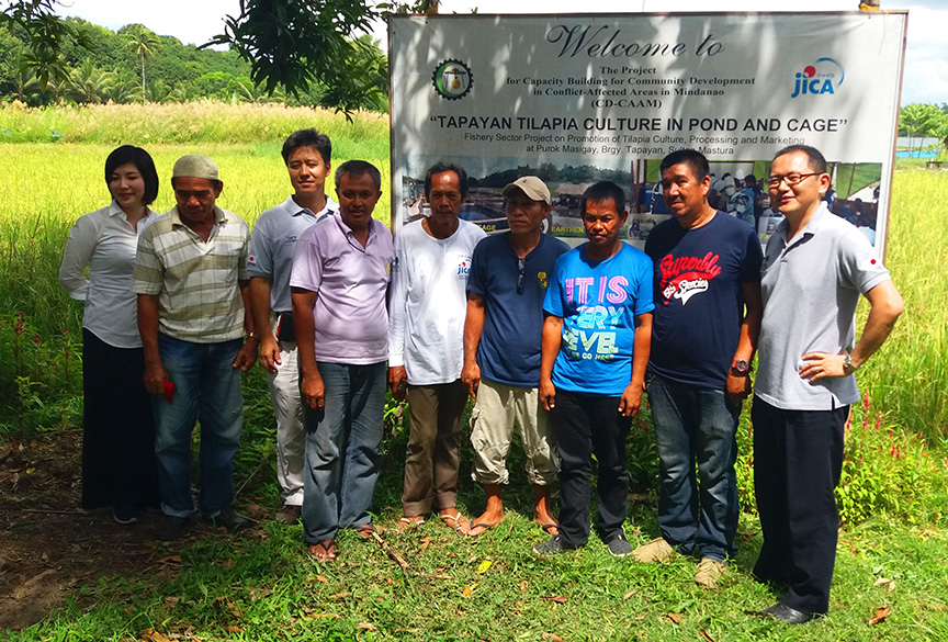 Members of Lake Tumingay Aqua Farmers Association together with the representatives from JICA, the Embassy of Japan and SEAC-IMT posed for a group photo during the recent project visit Purok Masigay, Tapayan, Sultan Mastura, Maguindanao. ALEXANDER D. LOPEZ