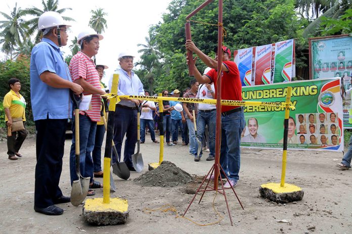 Governor Steve Chiongbian Solon (5th from left) leads the ground-breaking ceremony of the Calabanit - E. Alegado farm-to-market road (FMR) on December 6. Gov. Solon along with Provincial Engineer Jerry Belbider, Mayor Victor James Yap, local officials and contractors broke ground for the 4.0525-kilometer farm-to-market road from the national highway of barangay Calabanit to barangay E. Alegado. The P40-million project is mutually funded by the Philippine Rural Development Program of the Department of Agriculture and the Sulong Imprastraktura component of the Sulong Sarangani Program of Governor Solon in partnership with Senator Emmanuel Pacquiao, Congressman Roel Pacquiao, Vice Governor Elmer de Peralta, board members and municipal officials. (Kim Tiblani/PROVINCIAL GOVERNOR'S OFFICE)