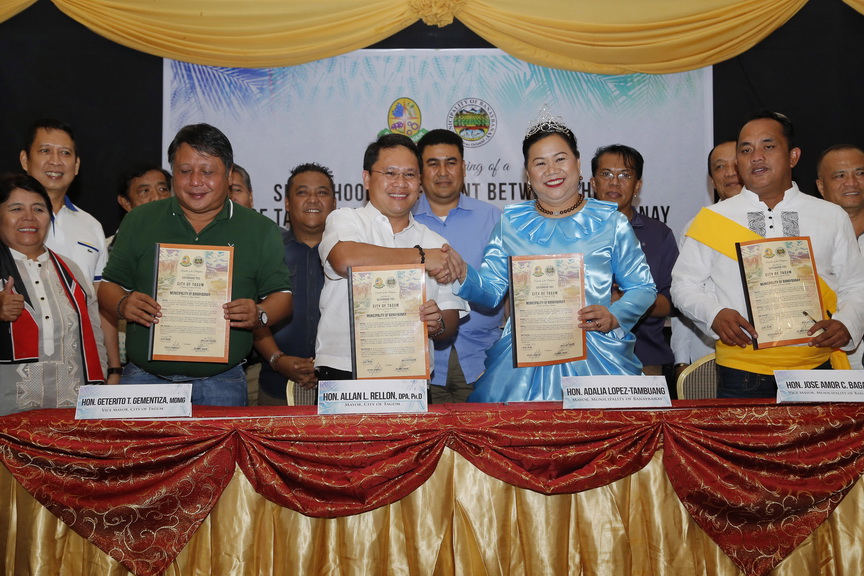 SISTERHOOD. Tagum City Mayor Allan Rellon and Bananay town Mayor Adalia ...