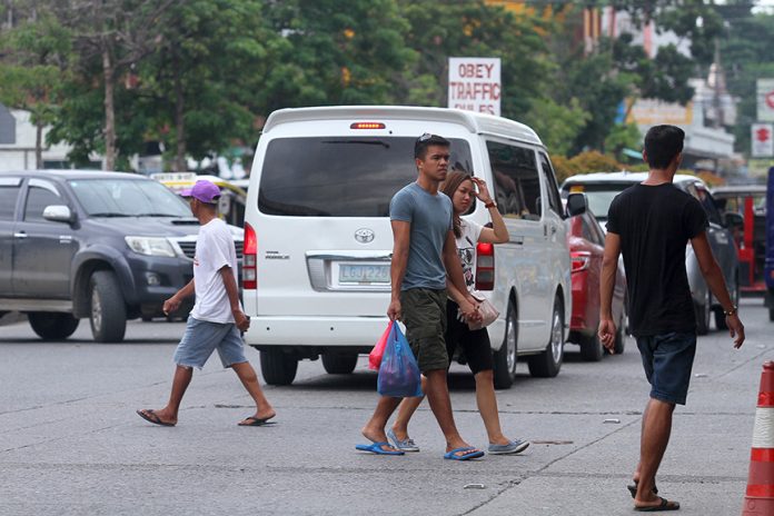 NOT IN THE LIST. Pedestrians can cross the street wherever they want along Lapu-lapu Street in front of Agdao Public Market as there are no pedestrian lanes in the area or traffic enforcers that supposedly will apprehend violators of the recently implemented Anti-Jaywalking Ordinance. LEAN DAVAL JR.