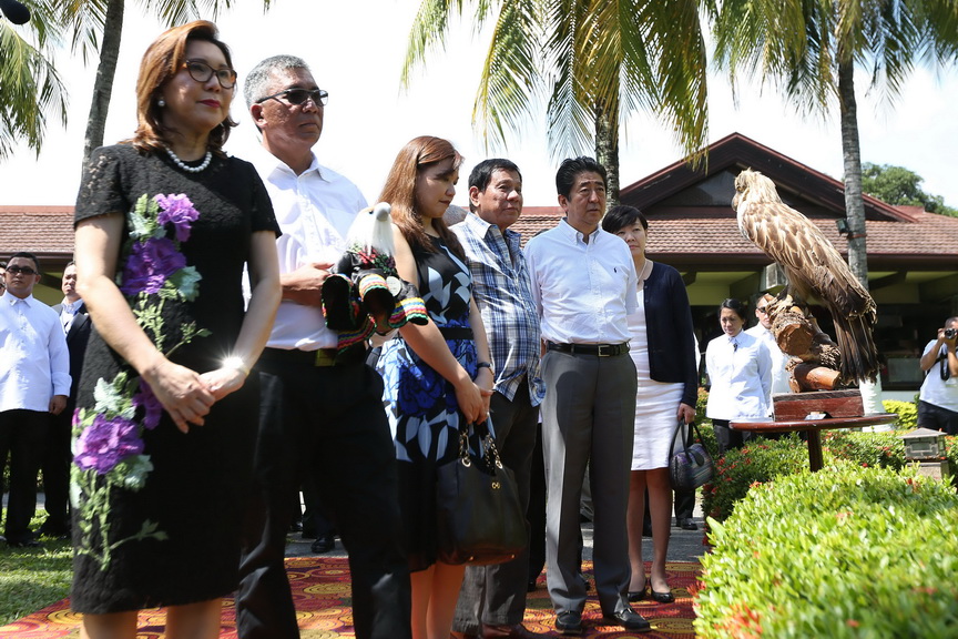 Japan Prime Minister Shinzo Abe and his wife Akie Abe pose with President Rodrigo Roa Duterte and his common-law wife Honeylet Avanceña after they received the stuffed toy of the Philippine Eagle named ‘Sakura’ during a ceremony at the Waterfront Hotel in Davao City on January 13, 2017. Also in the photo are Executive Secretary Salvador Medialdea, Finance Secretary Carlos Dominguez III, Philippine Eagle Foundation Executive Director Dennis Salvador and Tourism Secretary Wanda Teo. RICHARD MADELO/Presidential Photo