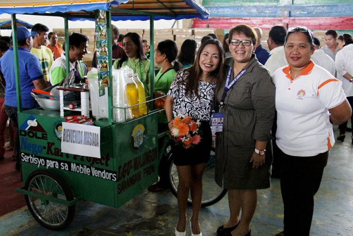 LIVELIHOOD ASSISTANCE. Alma P. Borela (center), Department of Labor and Employment Sarangani Field Office head, is flanked by (from left) PESO and DOLE’s local manager Cristina Constantino-Lapaz and staff Josie Casiple during the distribution of livelihood assistance to some 28 beneficiaries on January 9. Constantino said the DOLE-LGU project sharing led by Mayor Tessa Constantino and Borela was developed in an attempt to address the plight of poor and marginalized residents in the locality. (Apple Gella/MALUNGON INFORMATION OFFICE)