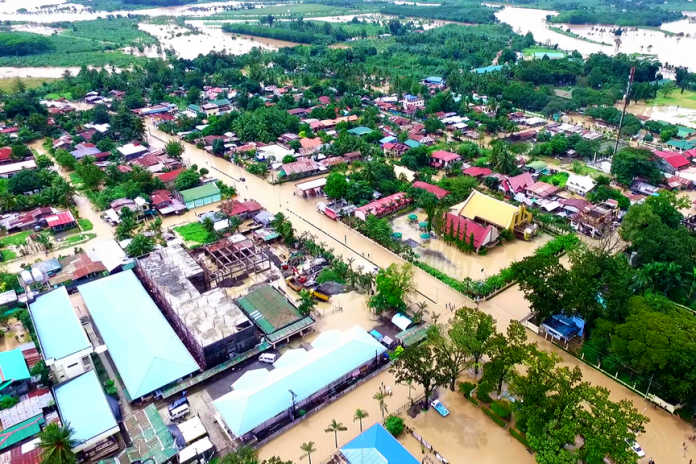 HARD-HIT. A bird’s eye view of the poblacion of Kapalong, Davao del Norte, one of the most affected provinces in Mindanao, shows the extent of the flooding brought by days of heavy downpour which displaced thousands of residents in this municipality and in other provinces. Photo courtesy of Billy Dandryll Dulatre/PIO DAVNOR