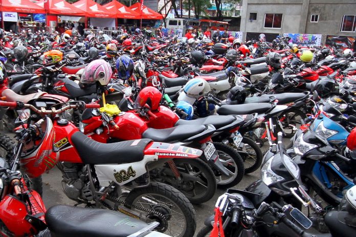 BIG BIKES GALORE. Riders walk by hundreds of motorcycles parked inside the Davao City Recreation Center during a gathering of motorcycle owners and enthusiasts over the weekend. LEAN DAVAL JR.