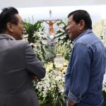 IN MOURNING. President Rodrigo Duterte condoles with Chief Legal Counsel Salvador Panelo whose son, Carlo, passed away recently. The President visited the wake of Panelo’s son at the Cosmopolitan Memorial Chapels and Crematory in Quezon City on Friday evening. ALBERT ALCAIN/Presidential Photo