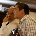 COMPARING NOTES. Presidential Communications Secretary Martin Andanar (right) confers with Presidential Spokesperson Ernesto Abella during the Freedom of Information Roadshow at The Royal Mandaya Hotel in Davao City on Saturday. LEAN DAVAL JR.