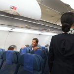 PASSENGER RODY. President Rodrigo Duterte is ushered to his seat as he takes a commercial flight from Manila to Davao City on Thursday evening. Here, the President greets the other passengers before taking a seat at the economy class section of the plane. TOTO LOZANO/ Presidential Photo