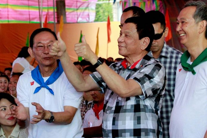 HIGH RATING TOO. President Rodrigo Roa Duterte gives the thumbs up sign as he enjoyed the performance of cultural dancers during the 20th anniversary of Premier Medical Center in Cabanatuan City on Wednesday. ALFRED FRIAS/Presidential Photos