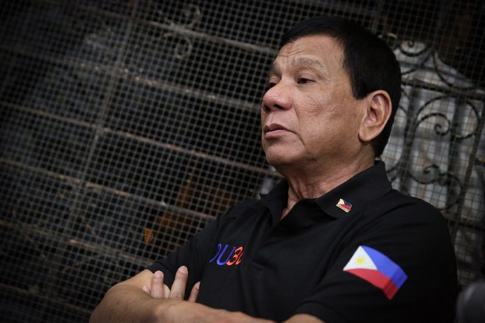 President Rodrigo Roa Duterte announces that he will suspend the peace talks with the National Democratic Front (NDF) as he answered queries from members of the media while visiting the grave of his mother Soledad 'Nanay Soling' Duterte at the Davao Catholic Cemetery in Davao City on February 4, 2017. KARL NORMAN ALONZO/ Presidential Photo