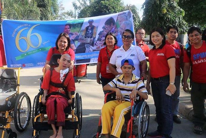 DSWD SUPPORT. Persons with disability Clark Jhon Cortez [left] and Joachim Dapitanon of Mati City receive their wheelchair during the Department of Social Welfare and Development (DSWD) 66th founding anniversary celebration in Mati City. A total of 17 wheelchairs and one pair of crutches were donated by DSWD, Southern Philippines Medical Center (SPMC) and the Church of the Latter-Day Saints. (DSWD Photo)