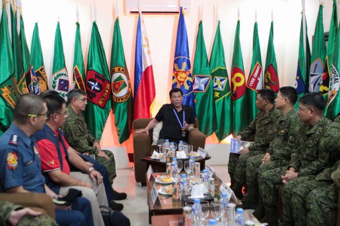 FIELD CONSULTATION. President Rodrigo Duterte presides over a meeting with officers from the Armed Forces of the Philippines and the Philippine National Police at the 4th Infantry Division Headquarters in Camp Evangelista, Cagayan de Oro City on Sunday. ALBERT ALCAIN/Presidential Photo