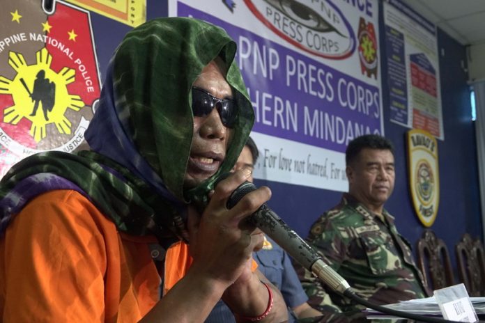 FED UP. Rebel returnee, Ka Junnie, said that he surrendered to the military because he could no longer stand the extortion operations of the New People's Army. He mentioned it in a press conference yesterday in Davao City Police Office. TIZIANA CELINE S. PIATOS.