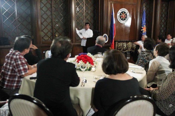 VANTAGE VIEW. President Rodrigo Duterte tells his former roommates at YMCA about the government’s war on drugs during the Reunion of the Knights of Galahad at the President’s Hall in Malacañan Palace on Sunday evening. ACE MORANDANTE/Presidential Photo