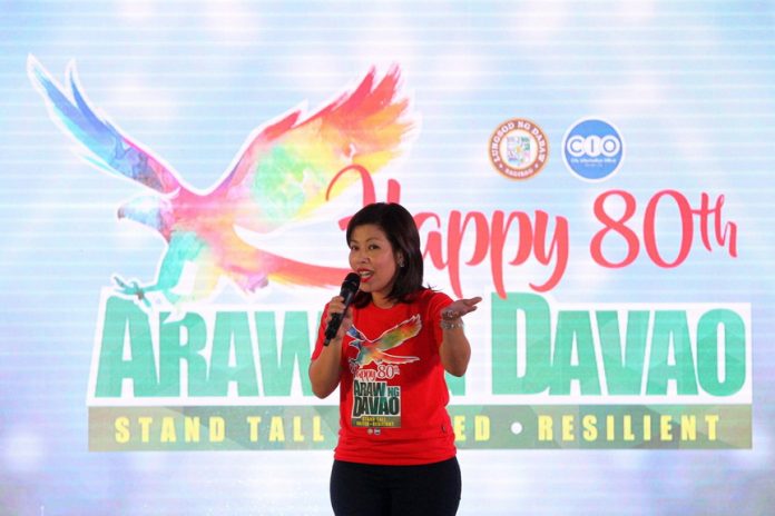 SETTING THE TONE. City administrator Zuleika Lopez speaks before the crowd during the official kick-off of the 80th Araw ng Davao at Rizal Park in Davao City on Wednesday evening. LEAN DAVAL JR.