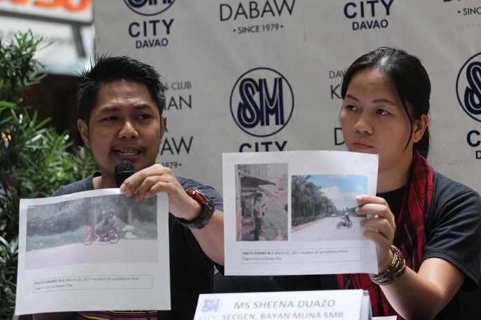 SITUATIONER IN THE LUMAD COMMUNITIES. Rius Valle (left) of SOS Network and Bayan Muna Southern Mindanao Region secretary general Sheena Duazo hold printed copies of alleged military intelligence agents who allegedly conducted harassments and surveillance against Lumad school teachers, activists and right defenders during the Kapehan sa Dabaw at the Annex of SM City Davao on Monday. LEAN DAVAL JR.