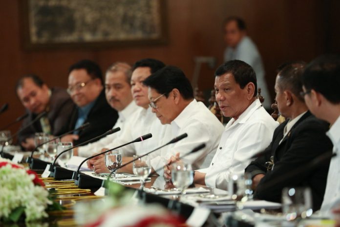 DINNER WITH LABOR LEADERS. President Rodrigo Duterte presides over a meeting with union leaders and officials of the Department of Labor and Employment (DOLE) at the State Dining Room at Malacañan Palace on Monday night. TOTO LOZANO/Presidential Photo