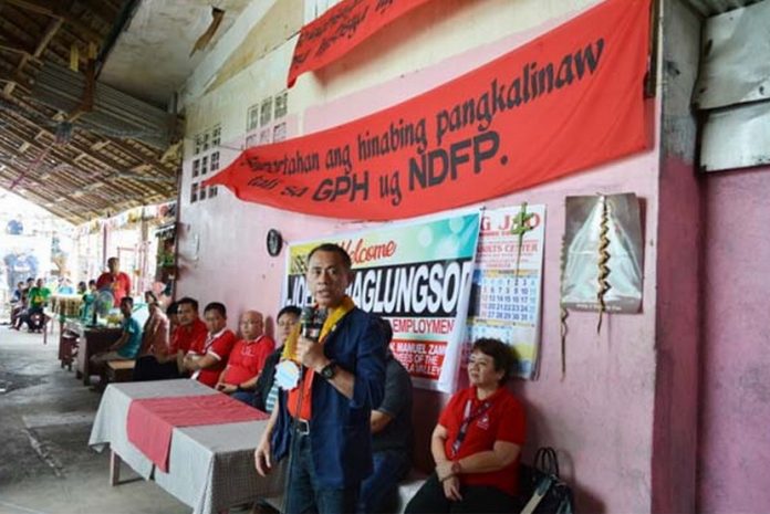 DOLE Undersecretary Joel B. Maglungsod gives a message before the inmates. (LRO/DOLEXI-DNFO)