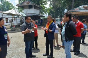 Jail Warden Jose Melvin Coquilla warmly welcomes the DOLE visiting team together with some of his jail officers and staff. (LRO/DOLEXI-DNFO)