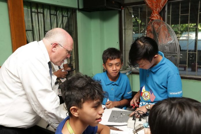 CDA Klecheski assembles solar-powered lamps with Access Program students at the Lights for All Project launch in Taguig.