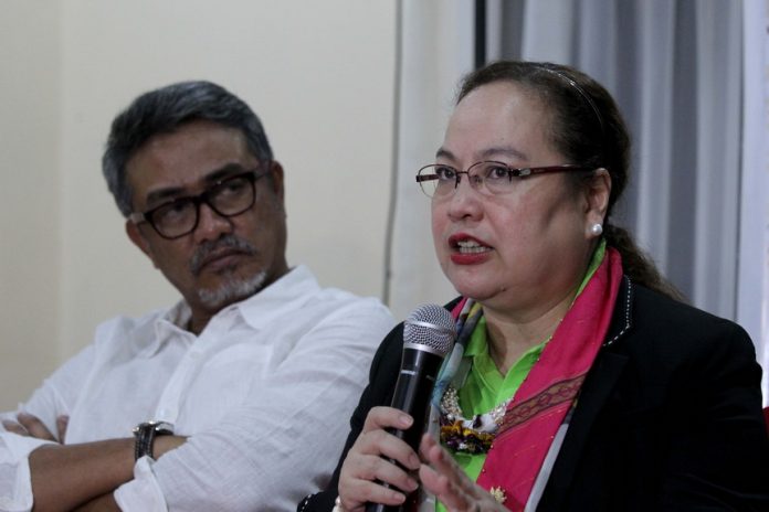 UPDATES. Department of Health secretary Dr. Paulyn Jean Rosell-Ubial provides updates on the Philippine Health Agenda 2016-2022 which includes DOH 30 – thirty things to do for City Health Office (CHO)/ Municipal Health Office while DOH DOH assistant secretary for Mindanao Dr. Abdullah Dumama Jr. listens during a news conference for the two-day CHO/MHO summit at The Royal Mandaya Hotel on Tuesday. LEAN DAVAL JR.