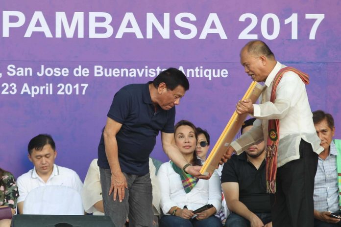 ICON TO ICON. President Rodrigo Duterte receives the Philippine Olympic Silver Medalists Stamp from Philippine Postal Corporation Postmaster General and CEO Joel Otarra during the opening ceremony of the Palarong Pambansa 2017 at the Binirayan Sports Complex in Antique over the weekend. ACE MORANDANTE/PRESIDENTIAL PHOTO