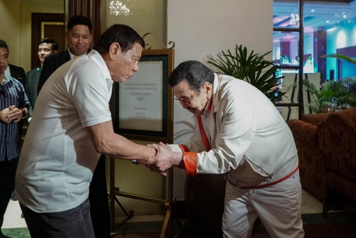 HONORED GUEST. President Rodrigo Duterte is warmly received by former President and incumbent Manila City Mayor Joseph Estrada upon his arrival at Manila Hotel on Wednesday night for Estrada's 80th birthday celebration. KING RODRIGUEZ/PRESIDENTIAL PHOTO