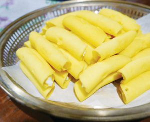 Plantanilla, a desset consisting of carabao milk pastillas wrapped with a light egg yolk crepe.