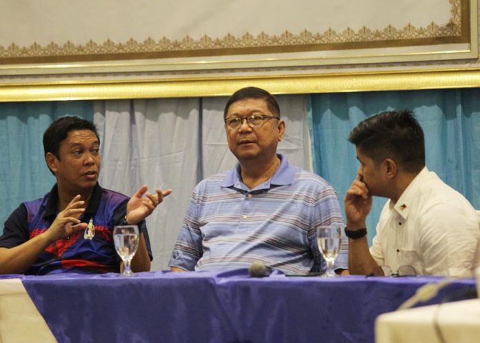 EXCHANGE OF NOTES.Philippine Sports Commission chairman William Ramirez (center) listens to the discussion between PSC commissioner Charles Raymund Maxey (left) and City Sports head MikeeAportadera during the opening of Barangay Sports Education seminar held at The Royal Mandaya Hotel in Davao City on Wednesday. LEAN DAVAL JR