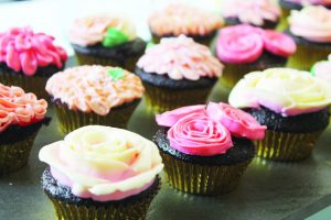 Moist chocolate cupcakes with flower buttercream