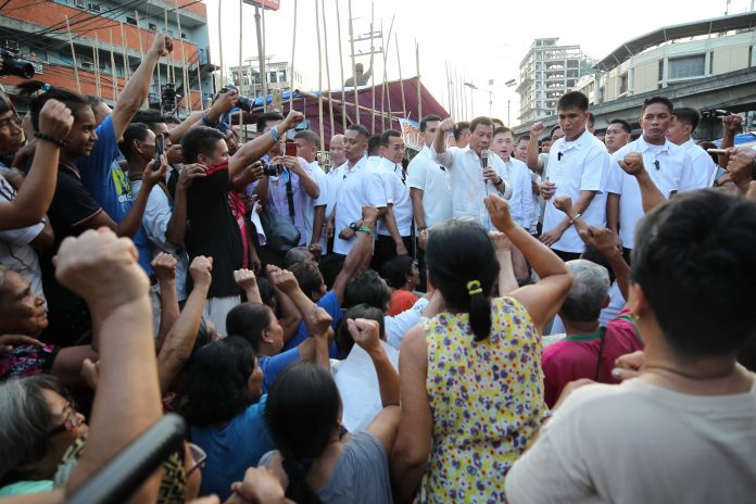 President Rodrigo Roa Duterte, outside of his schedule, listens to the concerns being raised by more than 200 farmers and farmworkers belonging to the Madaum Agrarian Reform Beneficiaries Association Incorporated (MARBAI) occupying Mendiola at the foot of Malacañang Palace on May 9, 2017. The farmers seek a demand that the President will enforce an installation order in their lands held by Lapanday Foods Corporation in Tagum City. Pres. Duterte, accompanied by Agrarian Reform Secretary Rafael Mariano, invited the farmers to a dinner at the Manila Hotel shortly after and provided a free ride going home for each. PRESIDENTIAL PHOTO