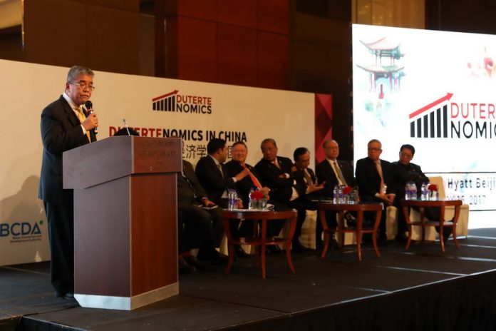 HIGH GEAR. Cabinet members of the Duterte administration hold an open forum on ‘DuterteNomics’, President Duterte’s strategy for economic governance, at the Grand Hyatt Beijing Hotel on Monday. PRESIDENTIAL PHOTO