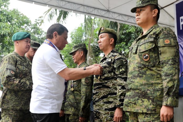 DESERVING. President Rodrigo Duterte leads the awarding of medals to deserving personnel during his visit to the troopers of the 603rd Brigade, 6th Infantry Division (6ID) of the Philippine Army (PA) at Camp Iranun in Sultan Kudarat, Maguindanao on Friday afternoon. PRESIDENTIAL PHOTO