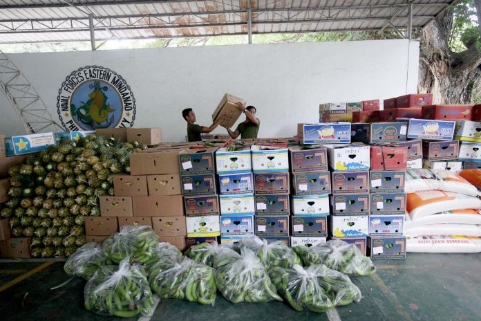 MARAWI-BOUND. Soldiers arrange boxes of bananas donated by a banana growers organization ready to be delivered to the victims of the recent conflict in Marawi City at the Eastern Mindanao Command (EastMinCom) in Panacan, Davao City on Friday afternoon. LEAN DAVAL JR.