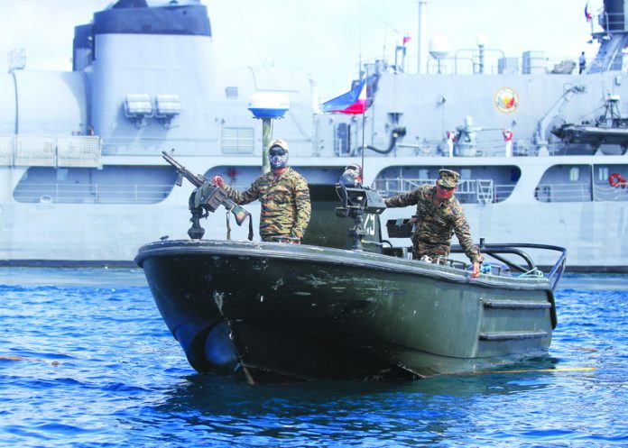 NEVER A DULL DAY. Navy Seal members of Philippine Navy conduct a sea patrol off the coast near Sasa wharf in Davao City on Monday. LEAN DAVAL JR.