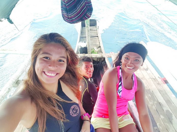 Surprised to find out that my local surfer friends, Iyay Magbago and Peter Ocdenaria were also the ones who were manning our boat for the dolphin watching!