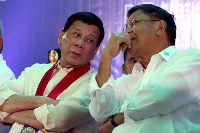 PRIVILEGED INFO. President Duterte discusses matters with Bureau of Internal Revenue (BIR) Commissioner Caesar Dulay on the sidelines of BIR's 113th Founding Anniversary celebration at the agency's national office in Quezon City on Wednesday evening. SIMEON CELI JR./PRESIDENTIAL PHOTO