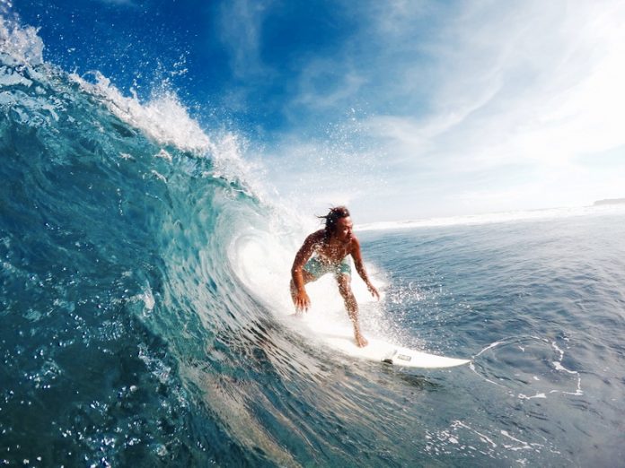 Siargao surfer gliding through a “small” day in Cloud 9. Photo by Bren Lopez.