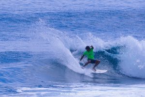 Another surfer showing off a power snap off the top with lots of spray. Photo by Gaps Sabuero