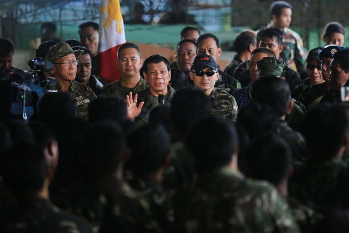 BOOSTING THE TROOPS.President Duterte talks to the soldiers in his latest visit to Marawi City. The President declared the liberation of Marawi City from ISIS-inspired Maute group on Tuesday after the military killed Abu Sayyaf leader Isnilon Hapilon and Omar Maute of the Maute group early morning of Monday. PRESIDENTIAL PHOTO