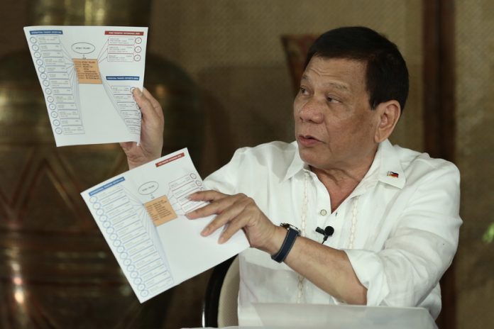 COMPLEX SET-UP. President Duterte shows a matrix of the politicians involved in the illegal trade as he explains how the operations are being carried out during Erwin Tulfo's program 'Sa Totoo Lang' which was aired on the People's Television on Fridaynight. RICHARD MADELO/PRESIDENTIAL PHOTO