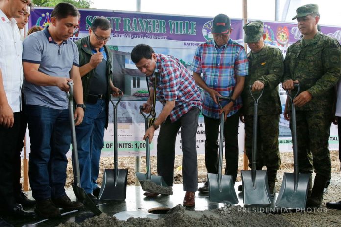 HOUSING AT LAST. President Duterte buries the time capsule during the groundbreaking ceremony of the Scout Ranger Ville in San Miguel, Bulacan on Wednesday afternoon. Assisting the President are National Housing Authority General Manager MarcelinoEscalada Jr., Housing and Urban Development Coordinating Council Chairperson Eduardo del Rosario, Defense Secretary DelfinLorenzana, Armed Forces of the Philippines Chief of Staff General Eduardo Año and Philippine Army Commander Major General Rolando Bautista. PRESIDENTIAL PHOTO