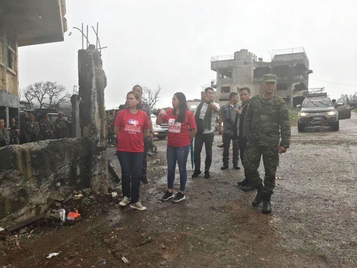 FIRST-HAND ASSESSMENT. Davao City Mayor Sara Duterte-Carpio, together with Taguig City Mayor Ma. Laarni Cayetano, visits the main battle area in Marawi City on Thursday. Duterte-Carpio and Cayetano were in Marawi to assess the intervention their group, the Tapang at Malasakit Alliance for the Philippines, can provide to the city and its residents and to personally hand over the two cities’ assistance of P5 million each. Photo courtesy of CIO/JefryTupas