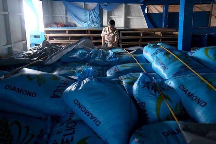 PAPERLESS CARGO.Naval Forces of Eastern Mindanao (NFEM) officer in charge Ensign Aileen Jansor shows dozens of sacks of rice which are part of the 5,000 bags of undocumented rice aboard M/B Sunlight that was apprehended by the authorities off the coast of Davao Oriental on Sunday. The vessel is currently under the custody of the Philippine Navy at Naval Station Felix Apolinario in Panacan, Davao City. LEAN DAVAL JR.