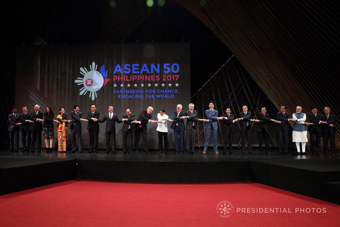 UNDER ONE ROOF. President Rodrigo Duterte and the rest of the leaders from the Association of Southeast Asian Nations (ASEAN) member states and dialogue partners do the traditional ASEAN handshake as they pose for a photo during the opening of the 31st ASEAN Summit and Related Summits at the Cultural Center of the Philippines in Pasay City on Monday. The dialogue partners include New Zealand, Timor-Leste, Republic of Korea, USA, Australia, India, China and Japan. PRESIDENTIAL PHOTO