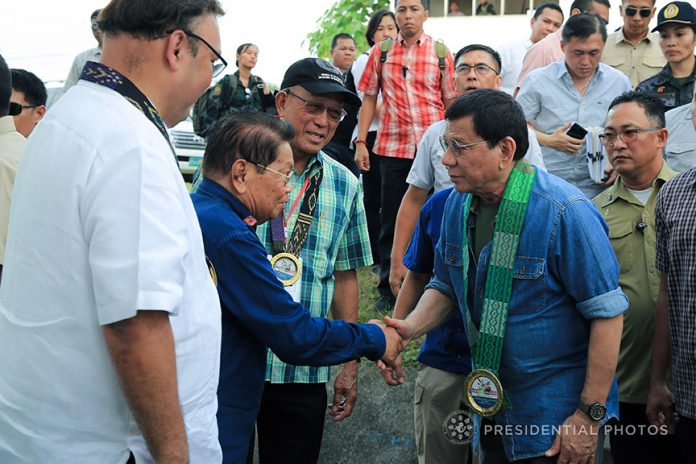 FOR THE BANGSAMORO. President Duterte is welcomed by Bangsamoro Transition Commission (BTC) Chairman Ghadzali Jaafar upon his arrival at the Old Provincial Capital in Sultan Kudarat, Maguindanao for his attendance to the Bangsamoro Assembly on Monday afternoon. Also in the photo is Defense Secretary Delfin Lorenzana. PRESIDENTIAL PHOTO