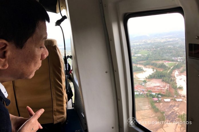 GETTING IT FIRST-HAND.President Rodrigo Duterte does an aerial survey on board a chopper on the hard-hit areas of Typhoon Urduja on Monday. He then convened with some members of his cabinet and local government officials to discuss the extent of the typhoon's damage as well as the response and relief efforts on the typhoon-stricken areas. SAP CHRISTOPHER LAWRENCE GO/PRESIDENTIAL PHOTO