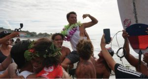 Philmar Alipayo raises his fist in celebration as his friend, .